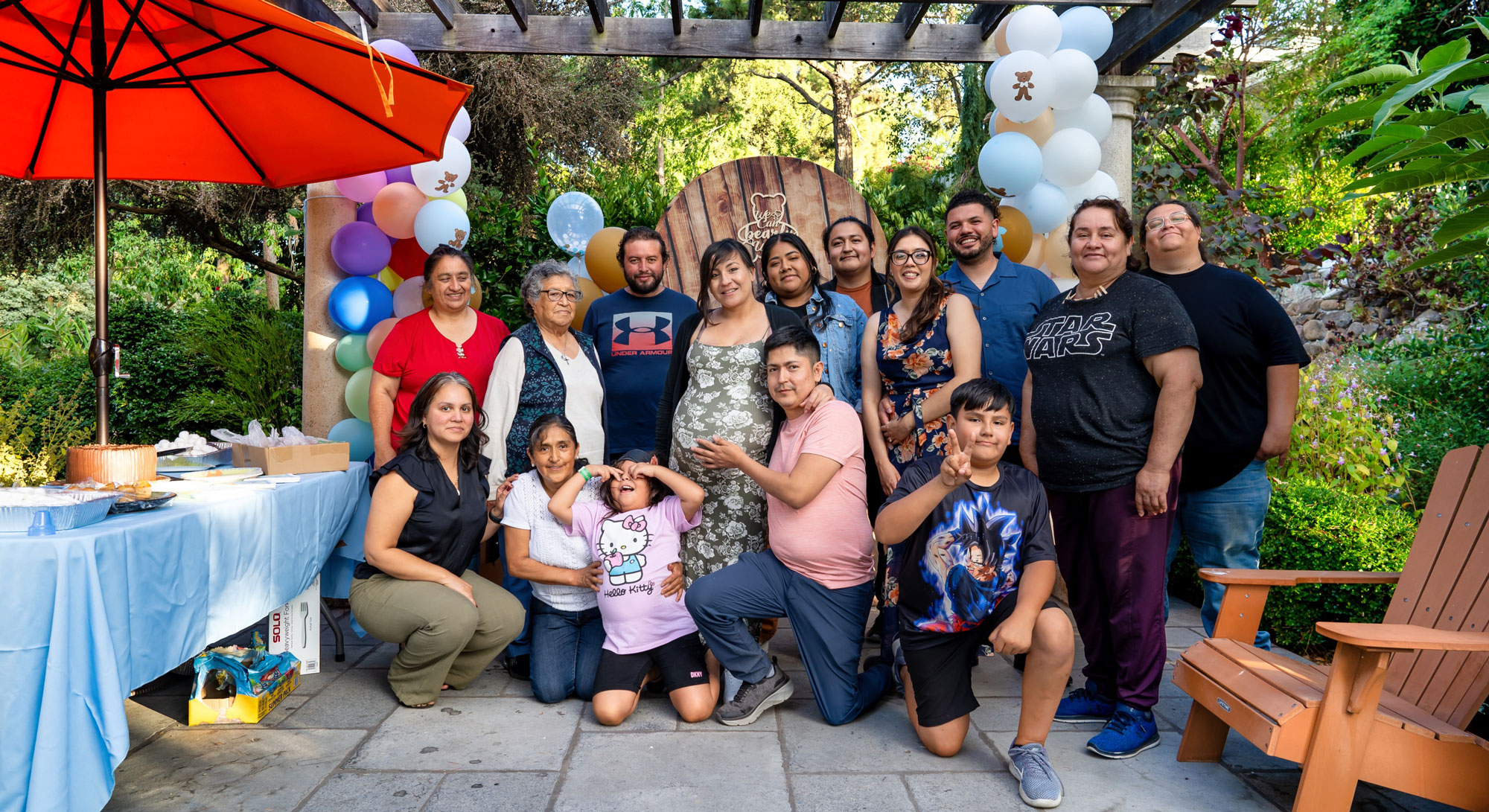 Karla, Birhon, and their family celebrating Gael’s baby shower in the garden.